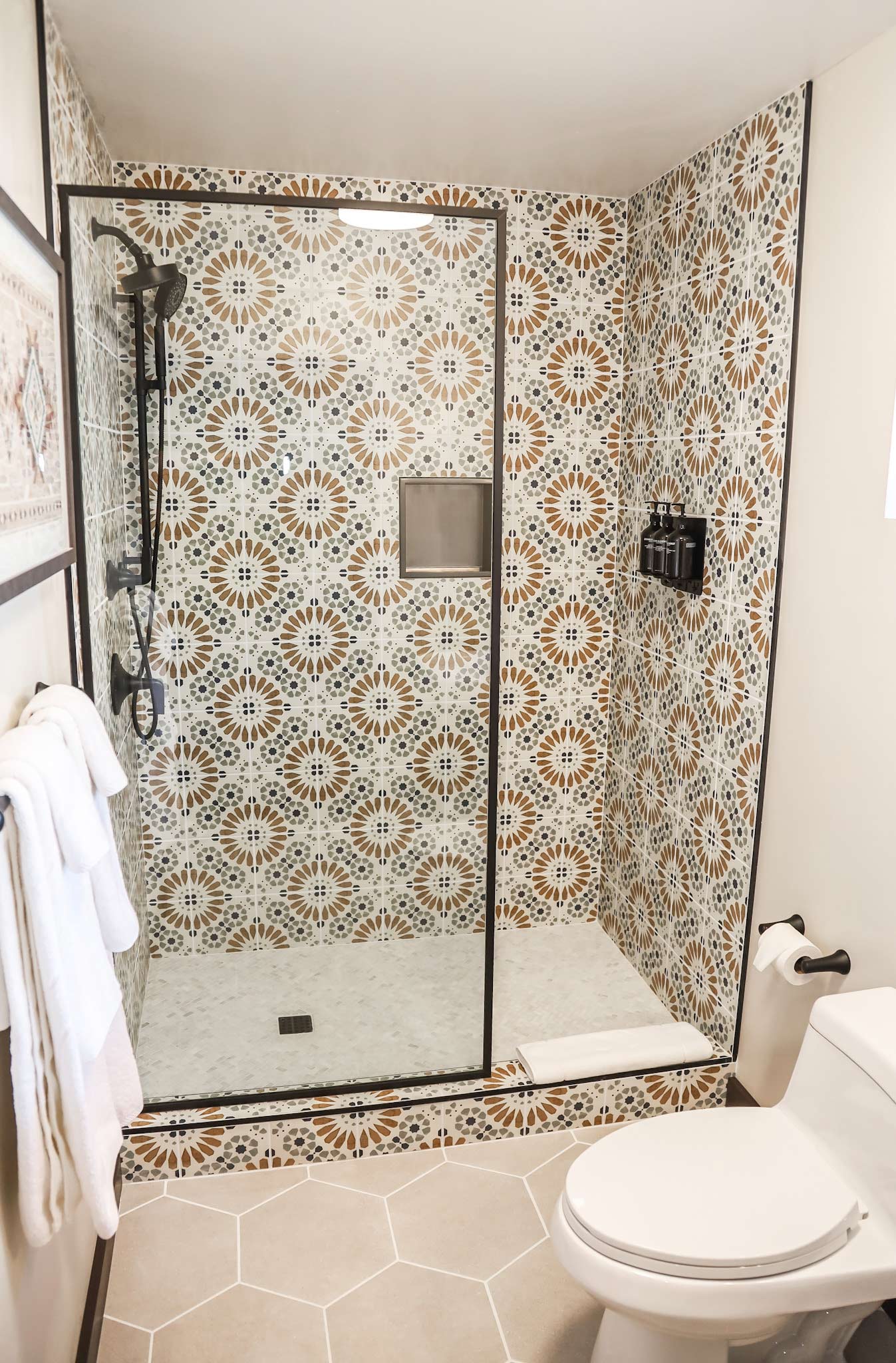 A view of the standing shower in the bathrooms